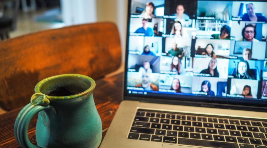 Remote selling involves virtual team meetings which this image shows on a laptop