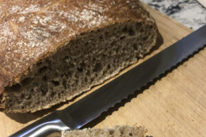 Picture of home-made sourdough loaf, with a slice removed